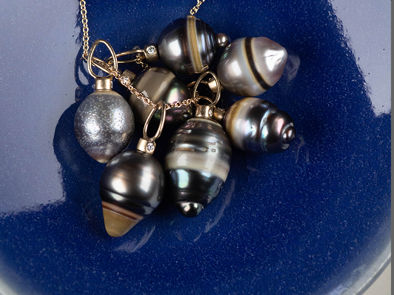 Oceanic Elegance: Enchanting Rings of Color on Tahitian Pearls