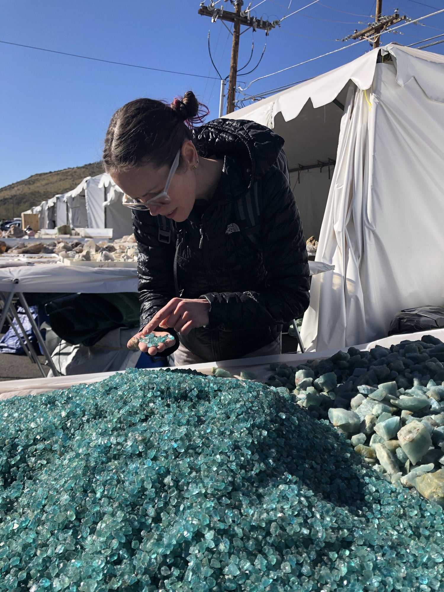 Karin digging through a pile of raw stones