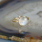Round Stone Gold Ring with Diamonds
